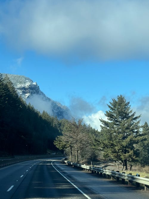 A highway with mountains in the background