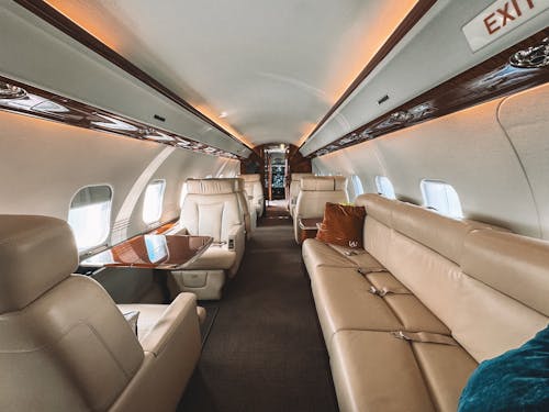 Beige Leather Seats and Wooden Trim Inside the Plane