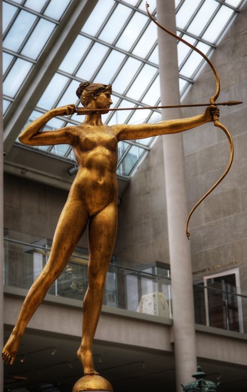 Free A bronze archer statue displayed indoors at a prominent New York museum. Stock Photo