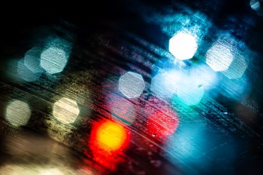 Vibrant abstract bokeh lights featuring blurred colorful patterns against a dark backdrop.