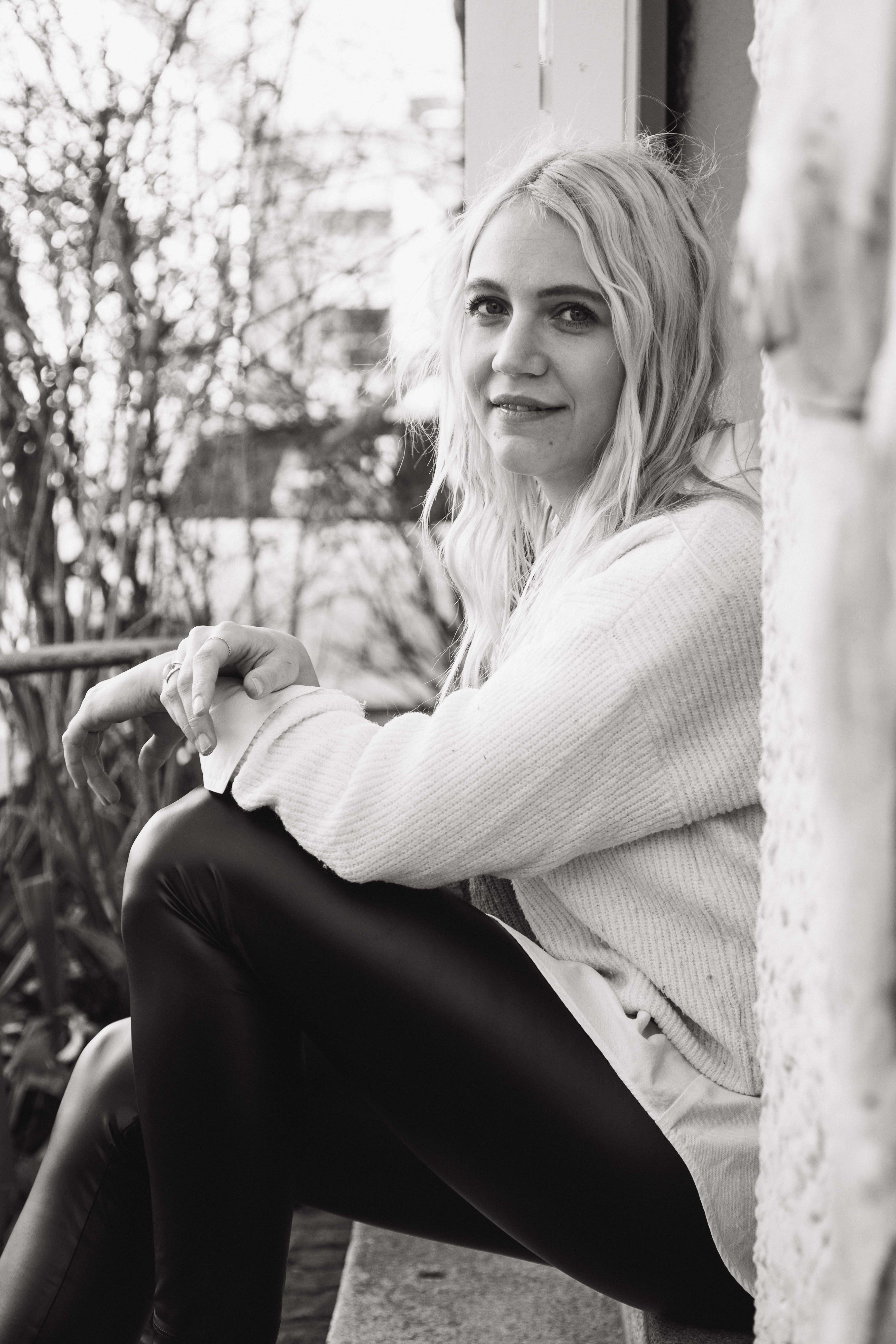 A Woman Sitting Outdoors · Free Stock Photo