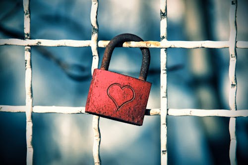 Padlock with Heart Locked on Fence