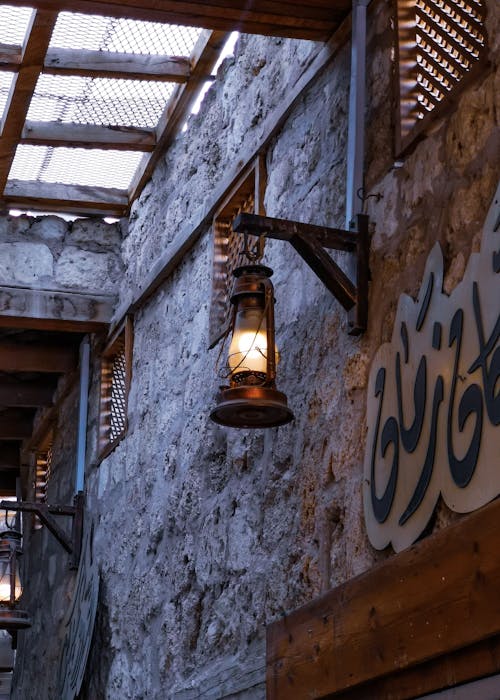 A light hanging from the ceiling of a building