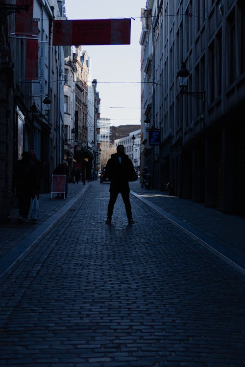 A person walking down a street with a backpack