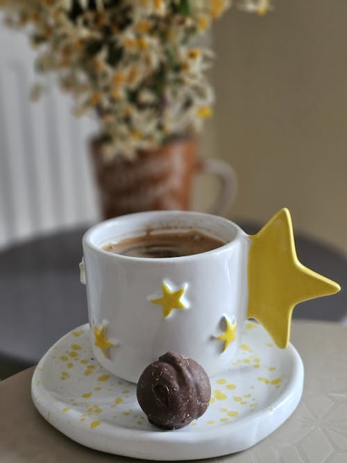 A cup of coffee with a star on it