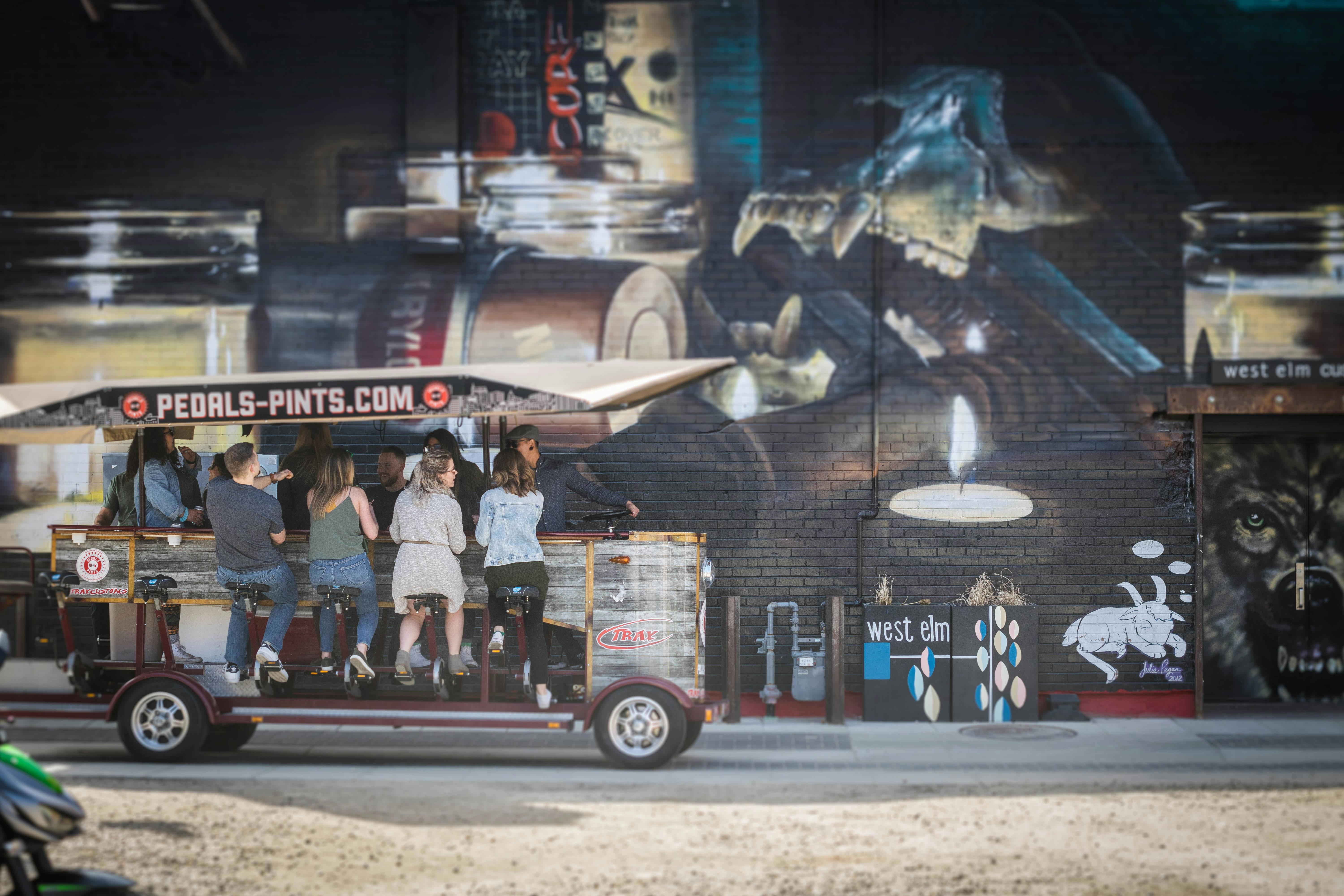 Four Women Sitting on Gray Food Cart \u00b7 Free Stock Photo