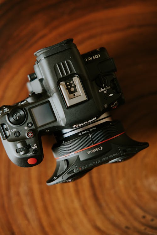 A camera on top of a wooden table