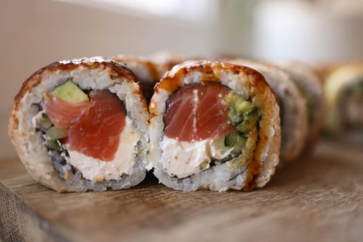 Close-up of sushi rolls with salmon, avocado, and cream cheese. Perfect for food lovers.