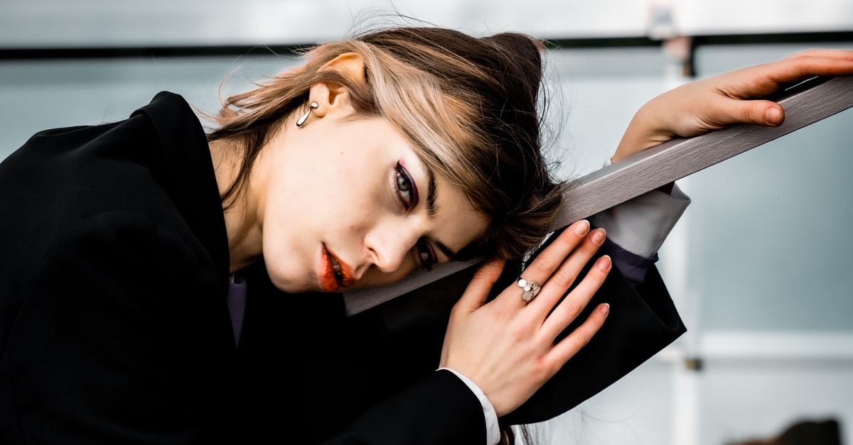 Woman Using Handrail Blonde Woman Leaning on Handrail · Free Stock Photo