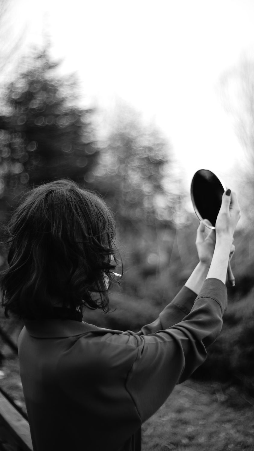 Free Photo Medium shot woman holding mirror Free Photo Medium shot woman holding mirror