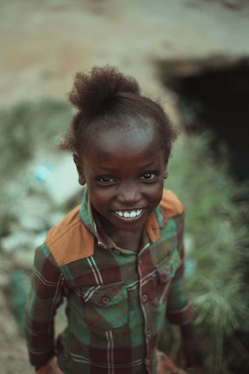 A young girl smiles for the camera