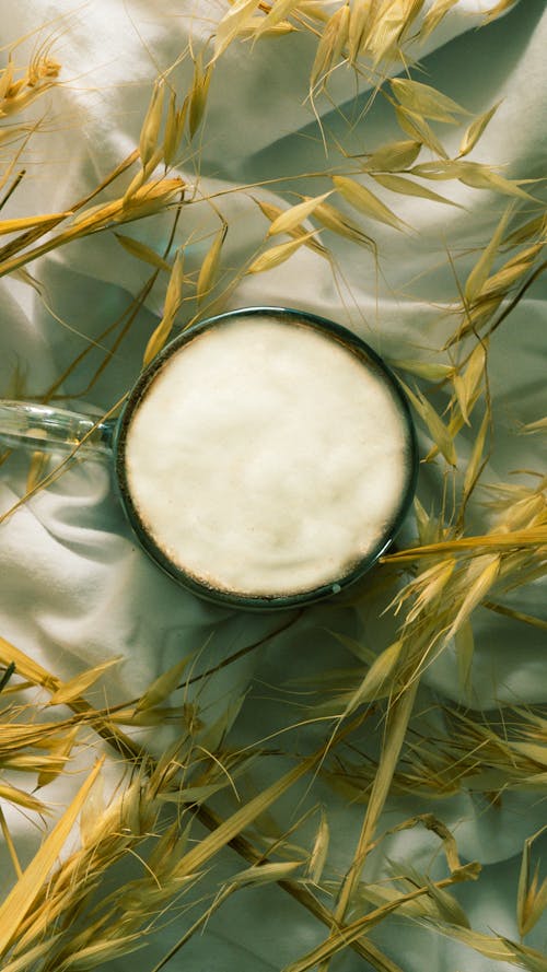 A cup of milk on a white cloth