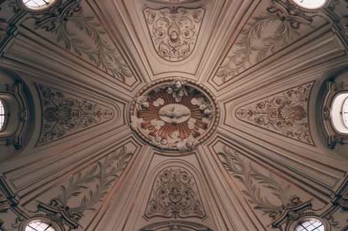 Free Ornate baroque ceiling design inside Santi Celso e Giuliano church, Rome, Italy. Stock Photo