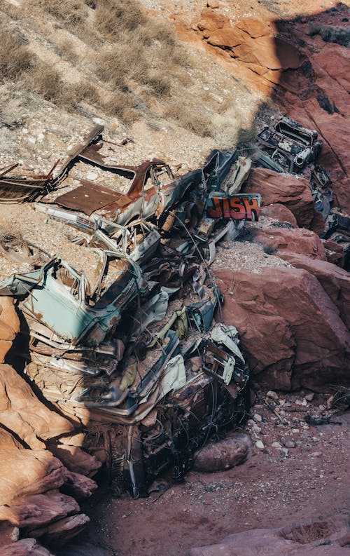 A pile of junk and rocks on a cliff