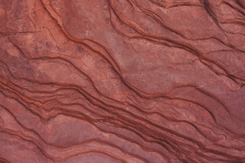 A close up of a red rock wall