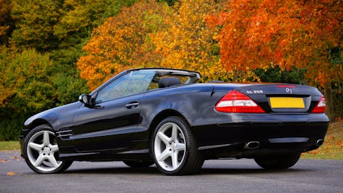 Black Mercedes Benz Convertible on Gray Concrete Floor