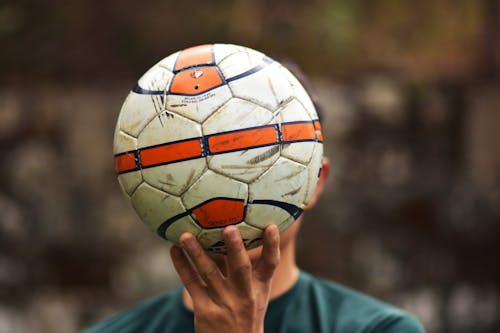 Man Holding a Ball 