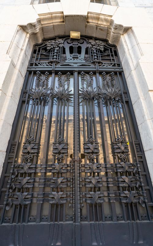Free Elegant Art Deco iron gate adorning a historic building's entrance in Mexico City. Stock Photo