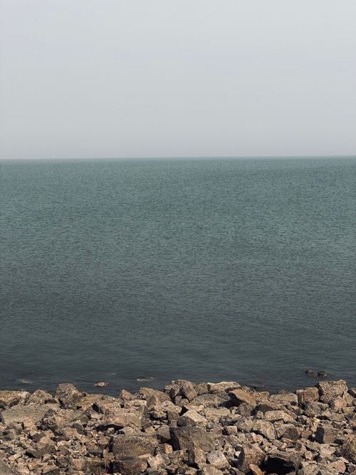 Free A tranquil view of the rocky coastline and sea at Baoshui District, Tianjin, China. Stock Photo
