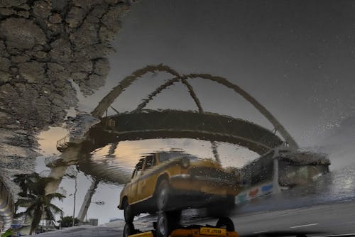 Taxi Reflecting in a Puddle 