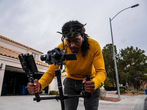 Man Holding Camera With Stabilizer