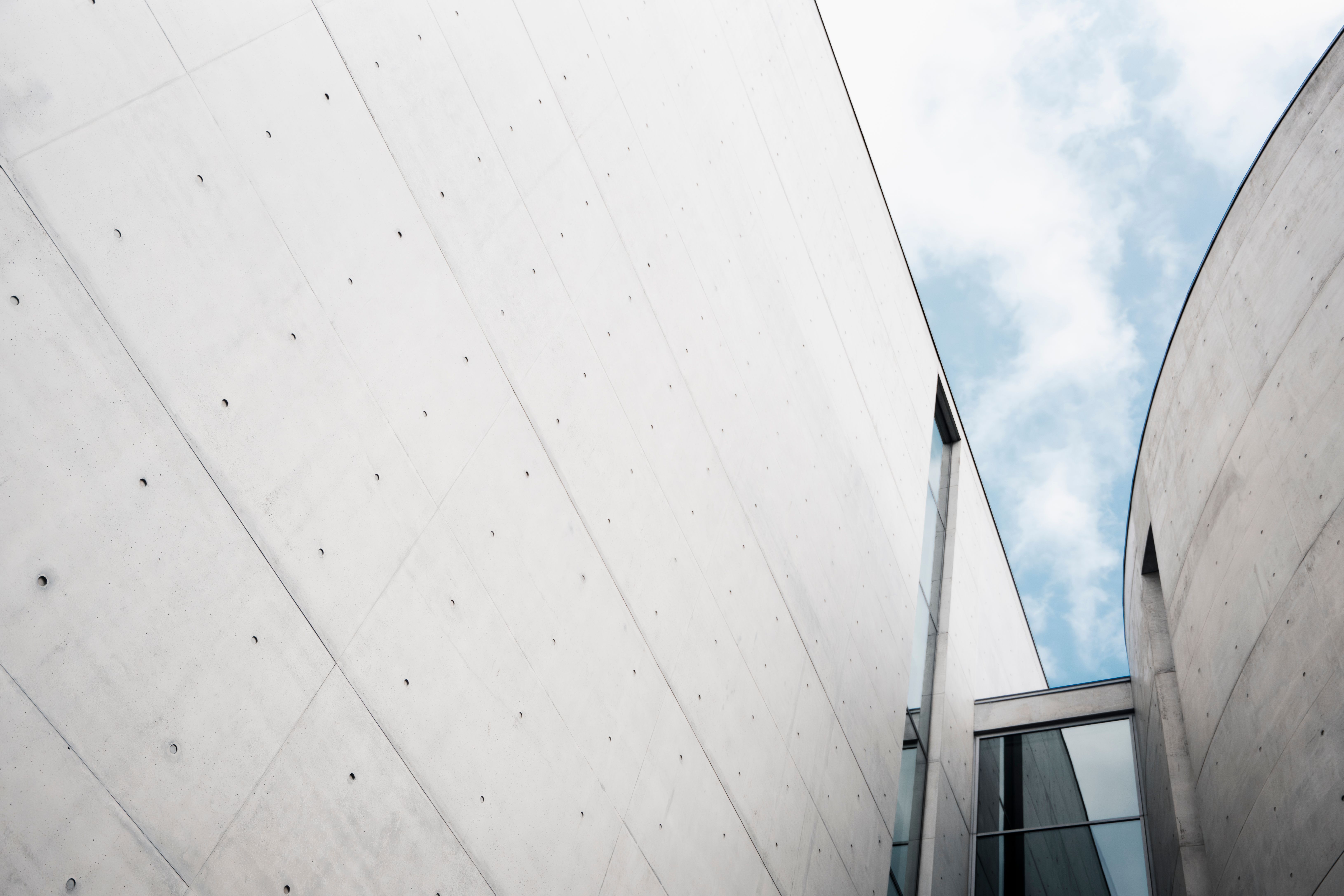 Minimalist architectural walls against a blue sky