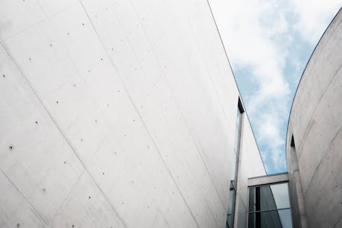 A building with a blue sky and white walls