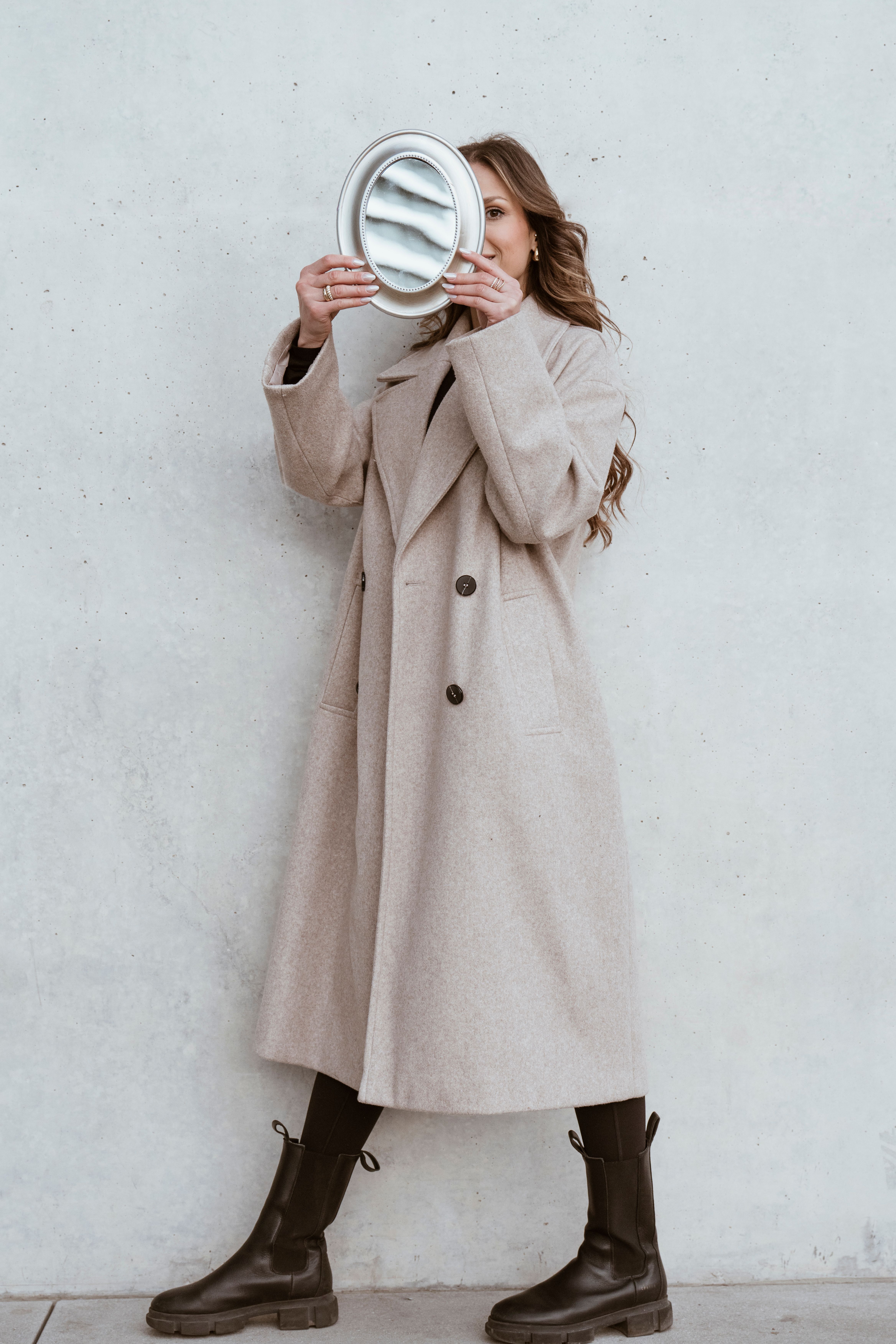 Model in Coat and with Mirror · Free Stock Photo