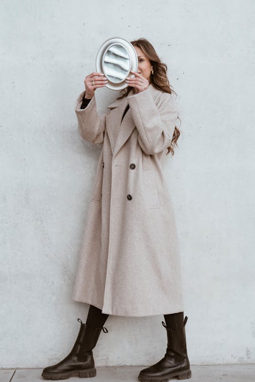 Model in Coat and with Mirror