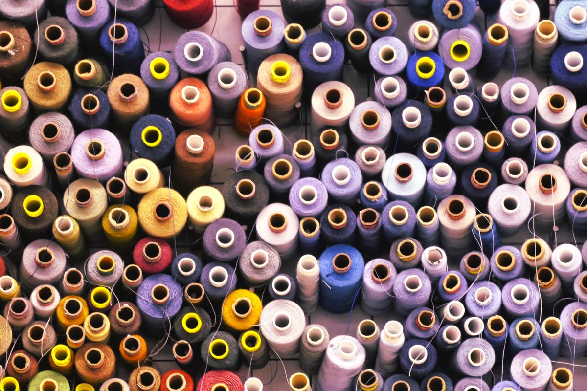 A close-up of colorful thread spools.