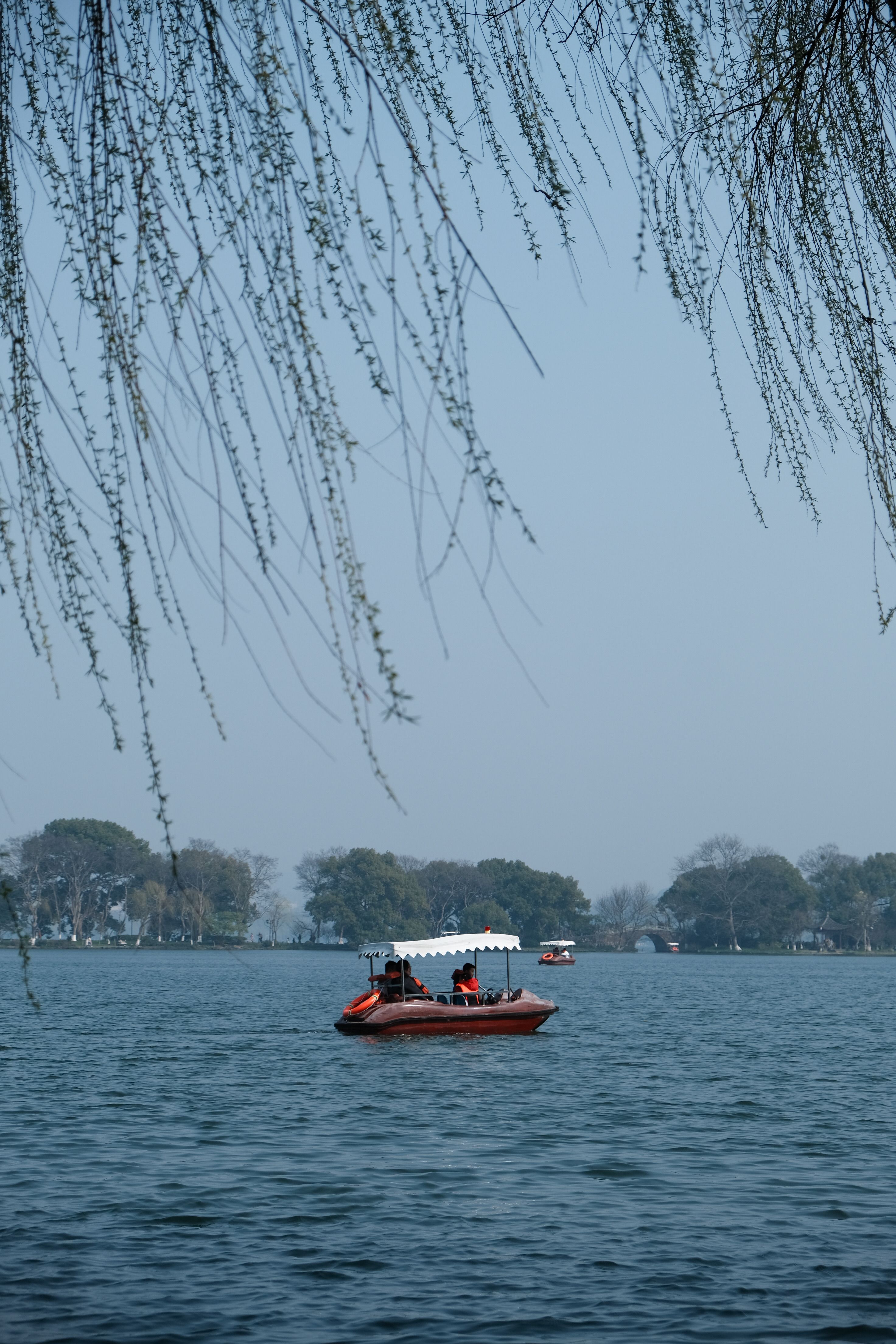 View of a Boat on a Body of Water under Blue Sky · Free Stock Photo