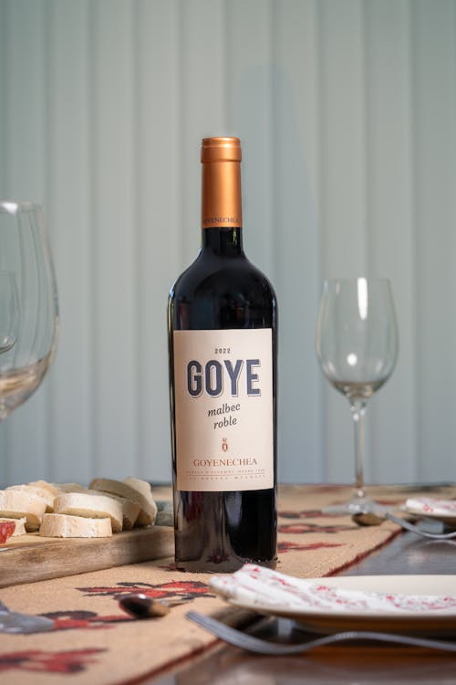 A bottle of goye wine sits on a table