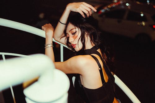 Young Woman Leaning on a Handrail 