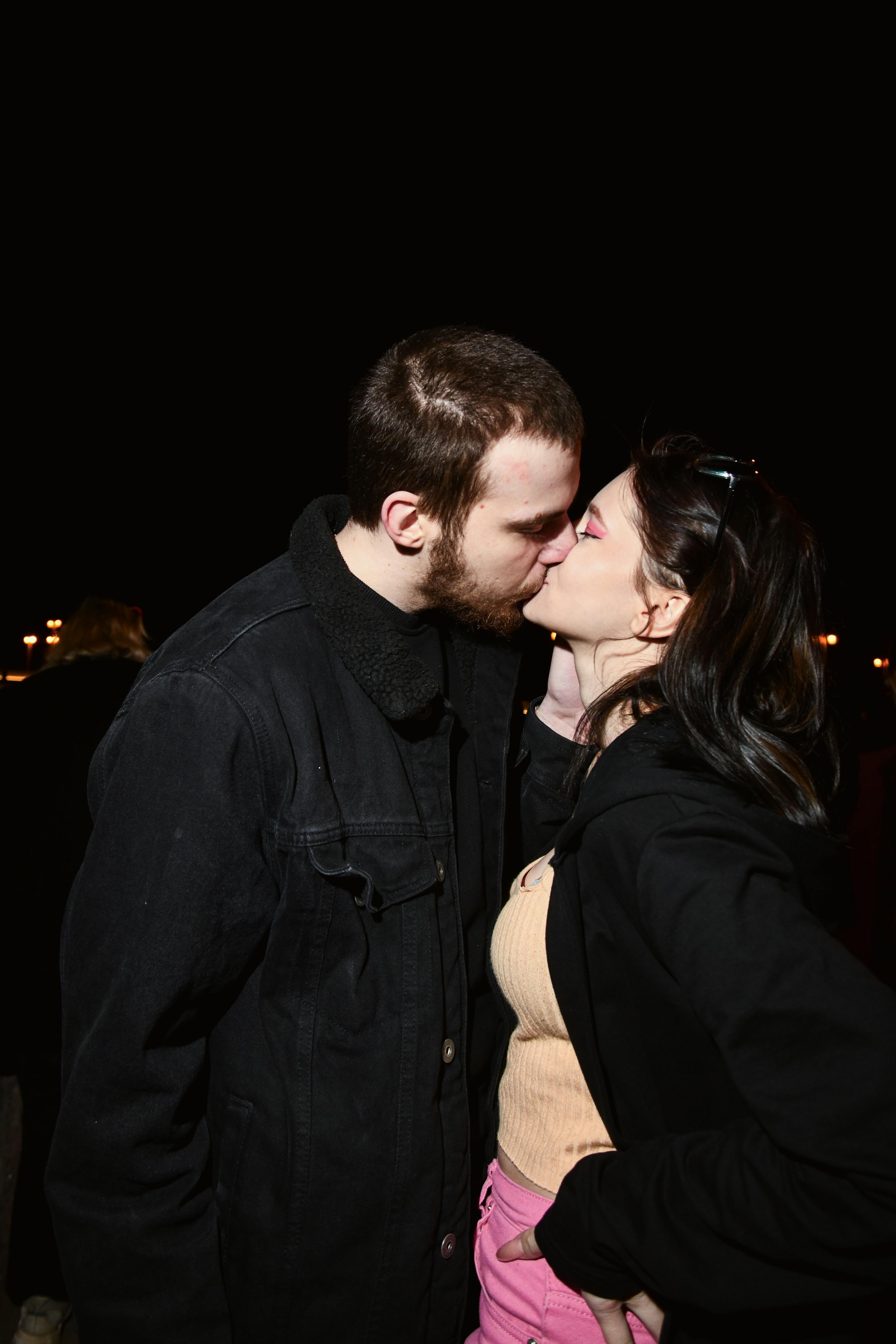 Couple Kissing Outdoors at Night · Free Stock Photo