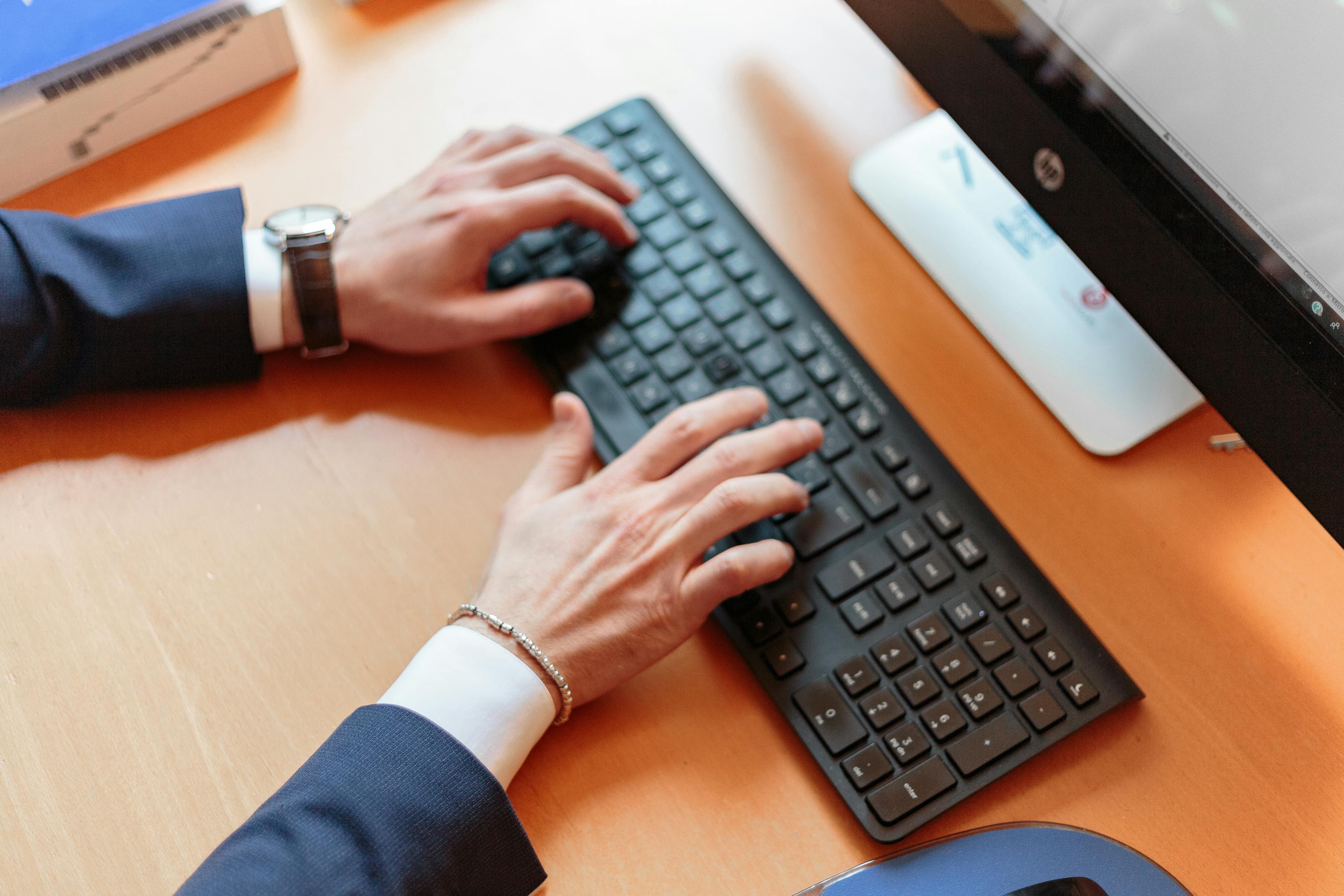 Person Using Wireless Computer Keyboard