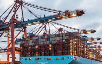 A cargo ship loaded with containers at Hamburg's bustling commercial dock.
