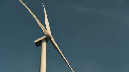 Free Wind Turbine Standing against a Clear Sky Stock Photo