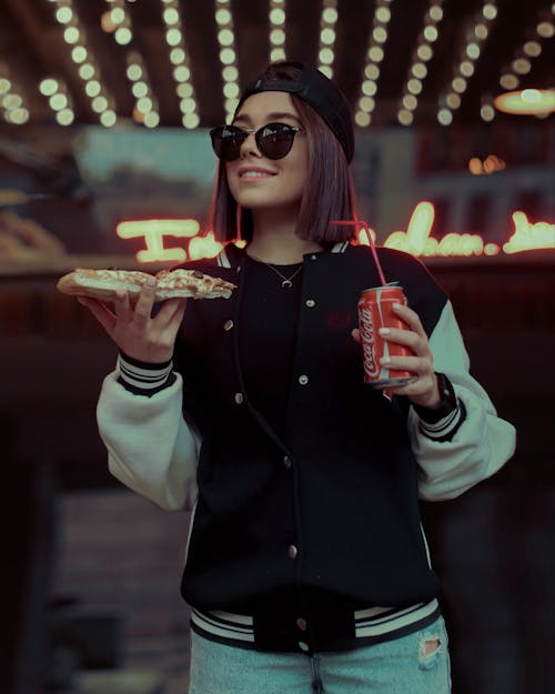 Smiling Woman in Sunglasses and with Food and Coca Cola