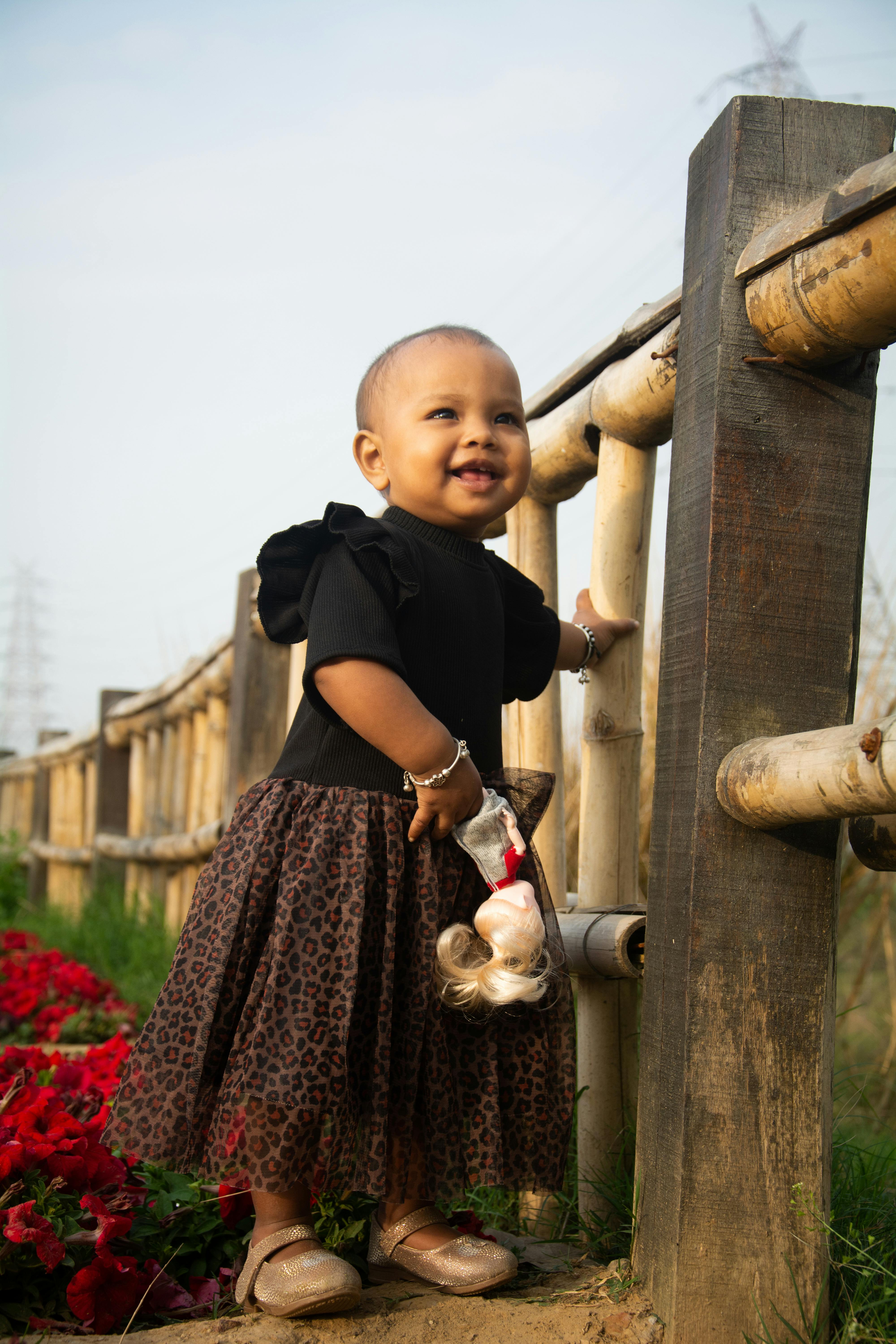 portrait of a little girl holding a toy