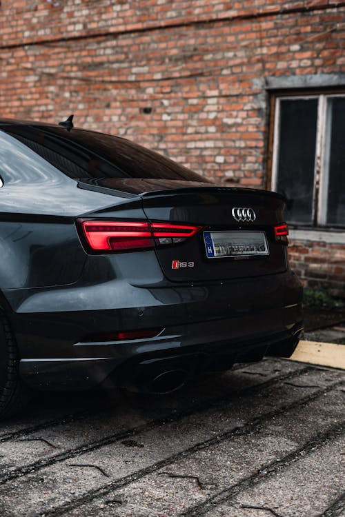 The rear end of a black audi sedan