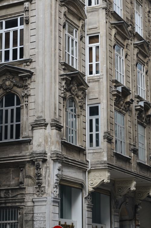 Free Detailed view of ornate neoclassical architecture on a townhouse facade in a city setting. Stock Photo