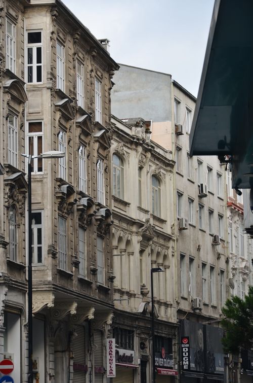 Free View of historic European style buildings in a city setting with urban charm and vertical perspective. Stock Photo
