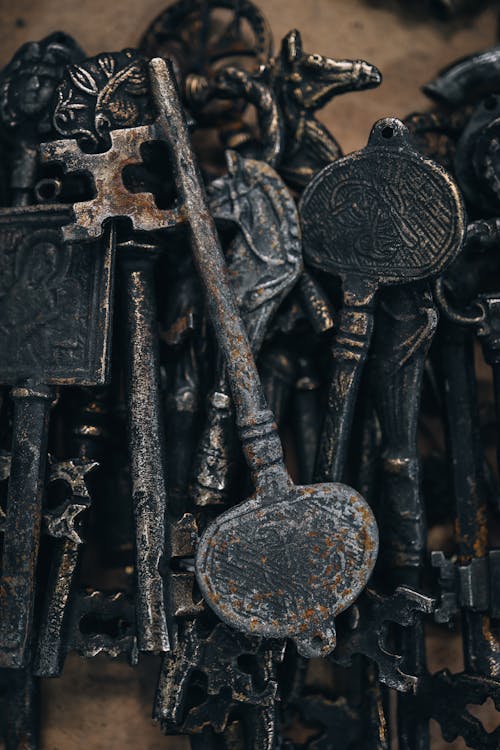 A bunch of old keys are displayed on a table