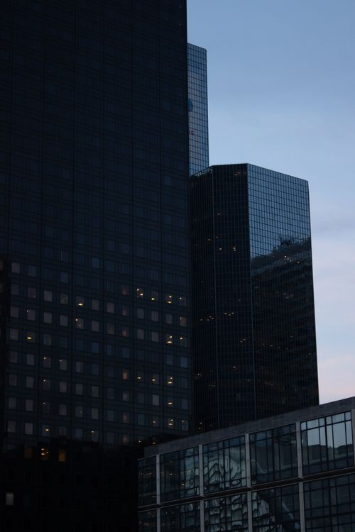 Free Capture of sleek modern skyscrapers in Paris during evening showing reflective glass facades. Stock Photo