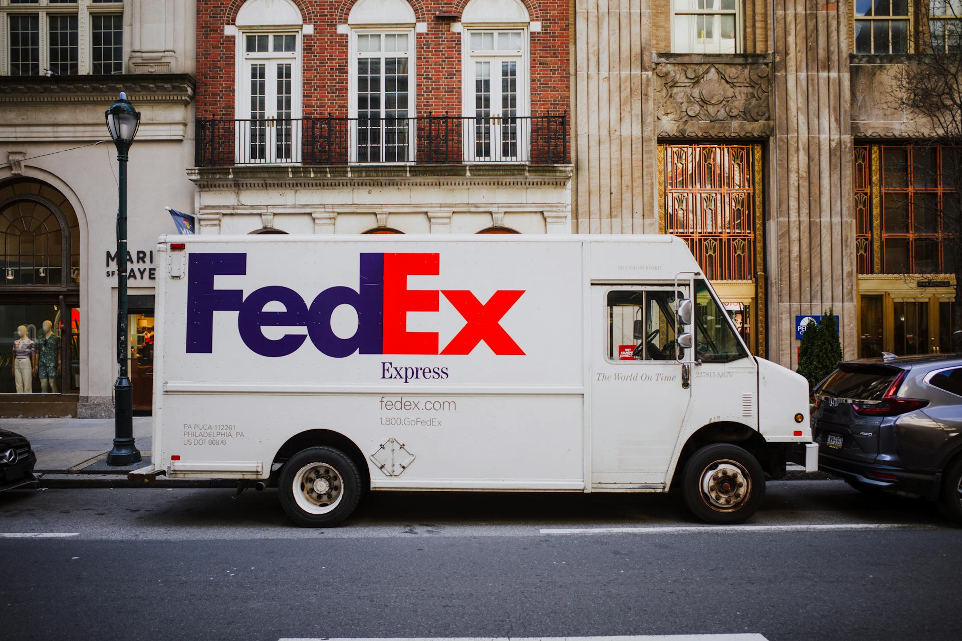 White FedEx Truck on Street in City