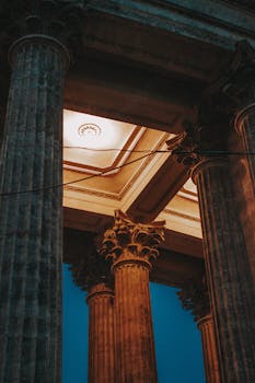 Majestic Corinthian columns lit up at twilight in Saint Petersburg, Russia.