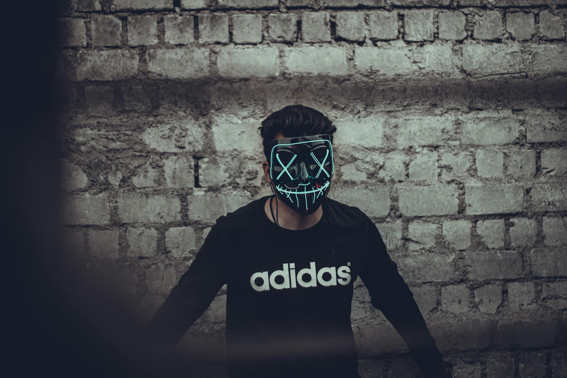 Man Wearing Black Adidas Long Sleeve Shirt And Mask