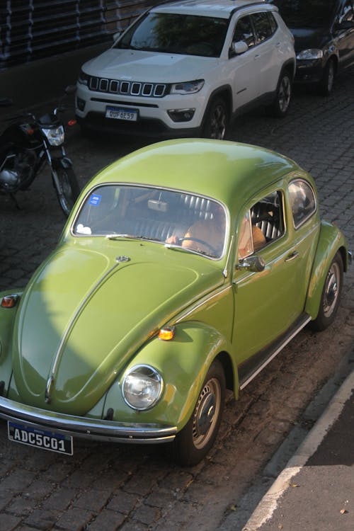 A green volkswagen beetle