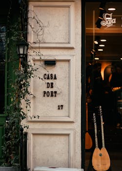 Charming café entrance with vines and guitars on display, offering a warm urban ambiance.