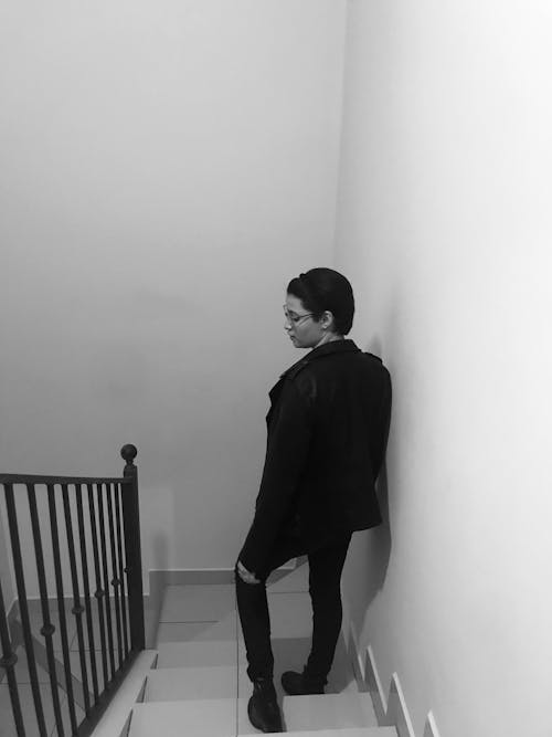 Person in Eyeglasses Standing in Stairs